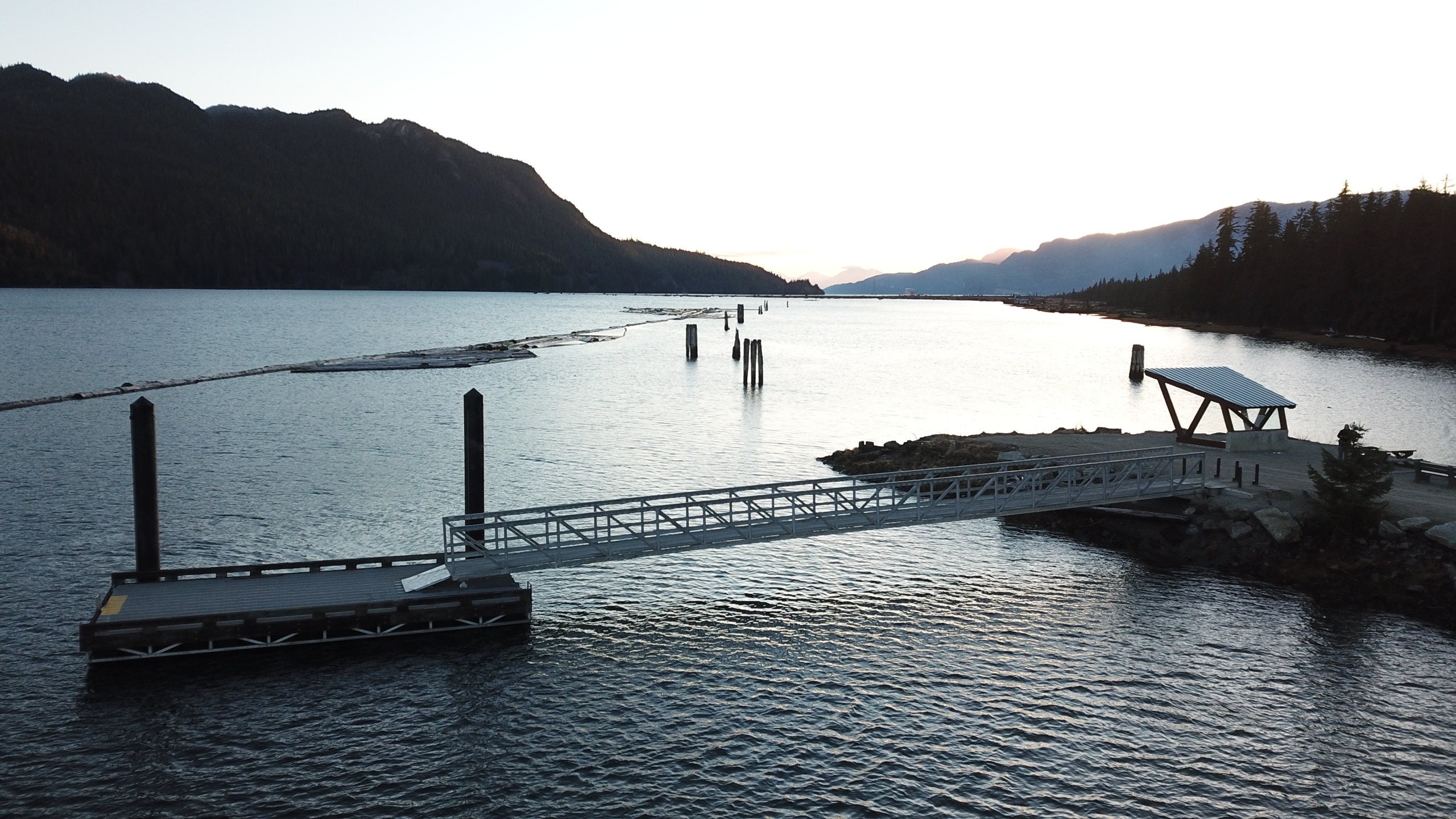 A dock on a saltwater channel of water.